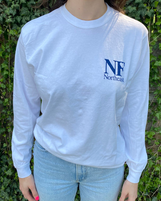 image of woman in white long sleeve shirt with NF Northeast logo printed in navy blue on left chest - Youth shirt is same design but sized for children